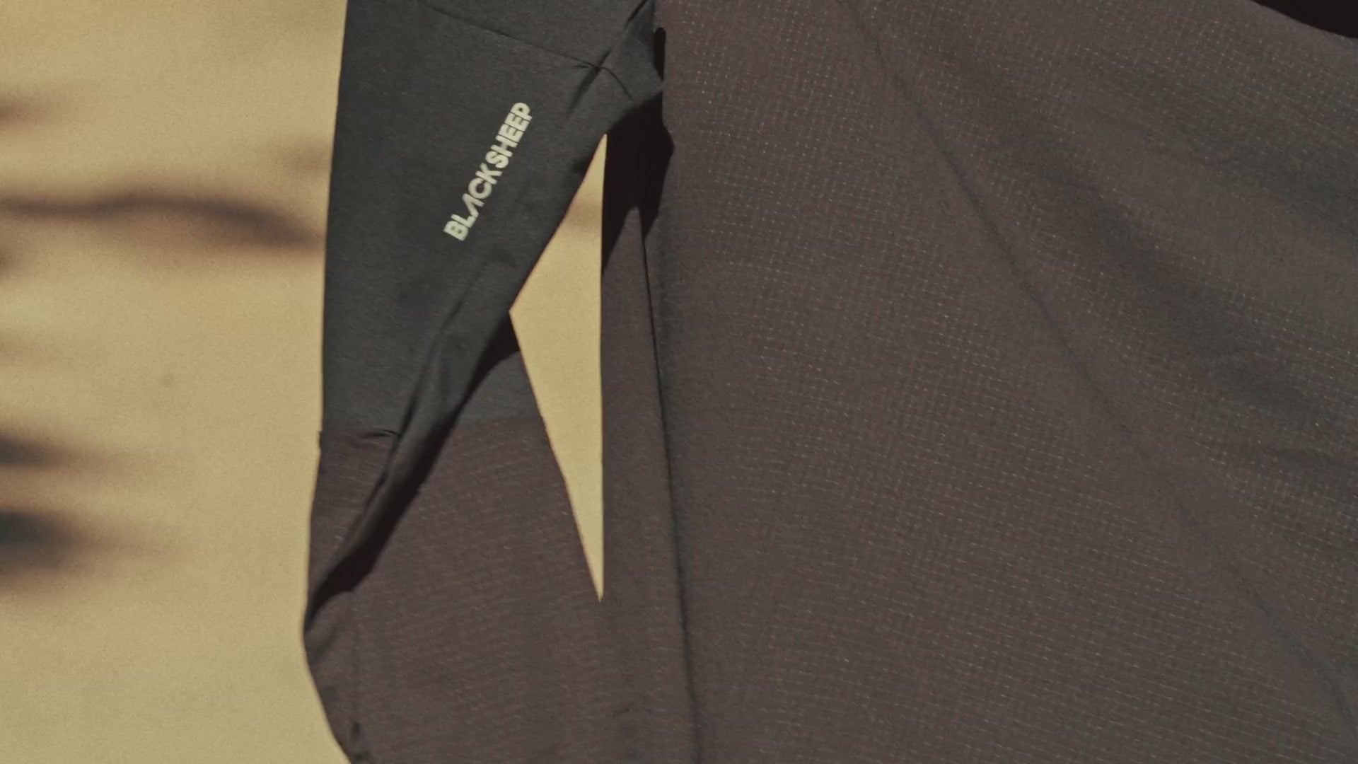 Close-up of the Enduro LS Tee sleeve with its reflective logo
